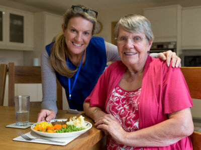 volunteer delivering meals to a senior