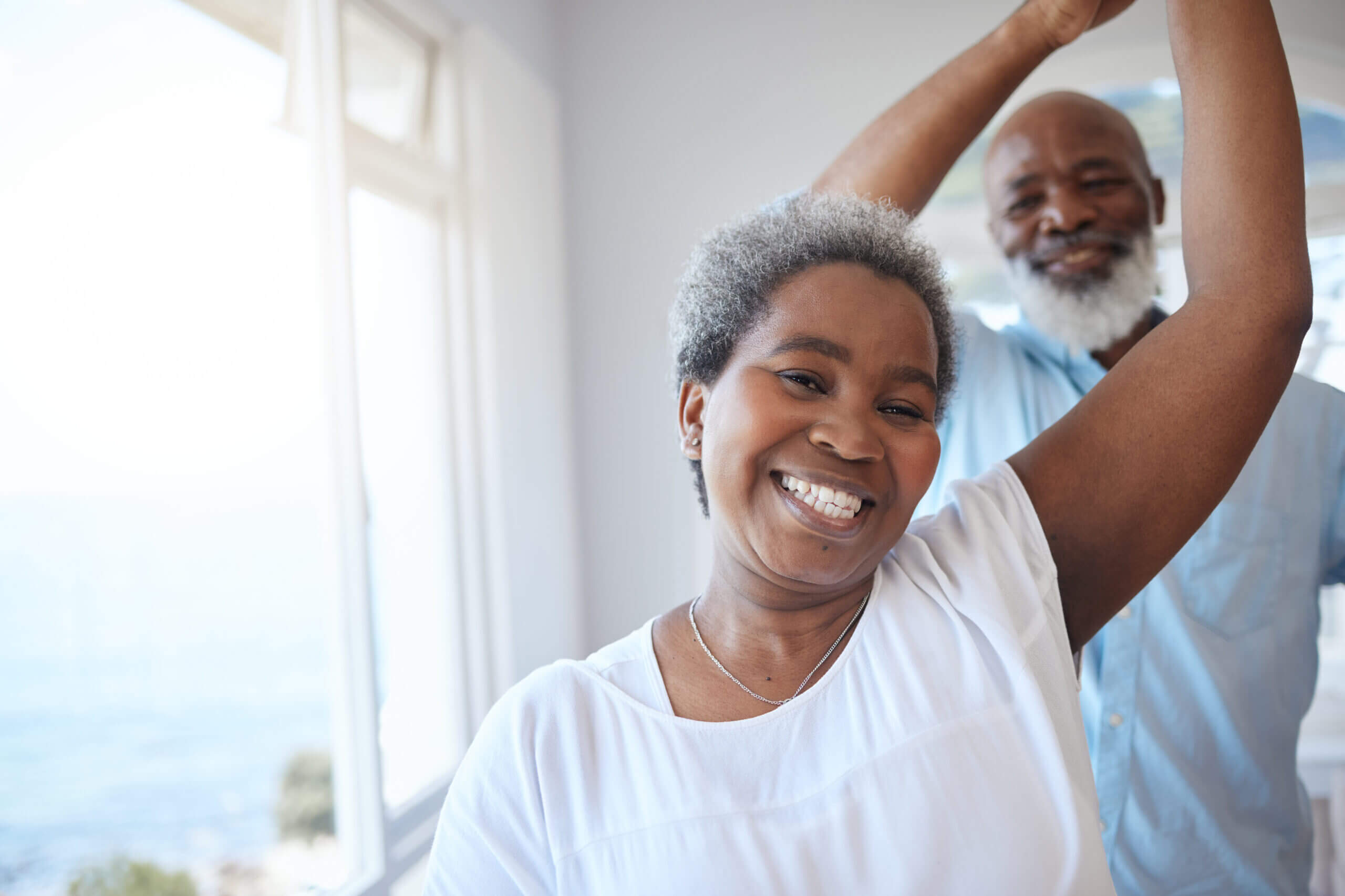 Shot of a mature couple sharing a dance inside