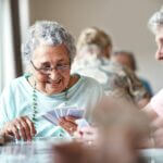 senior woman playing cards