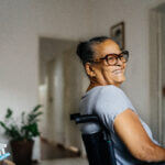 Wheelchair woman smiling in the room