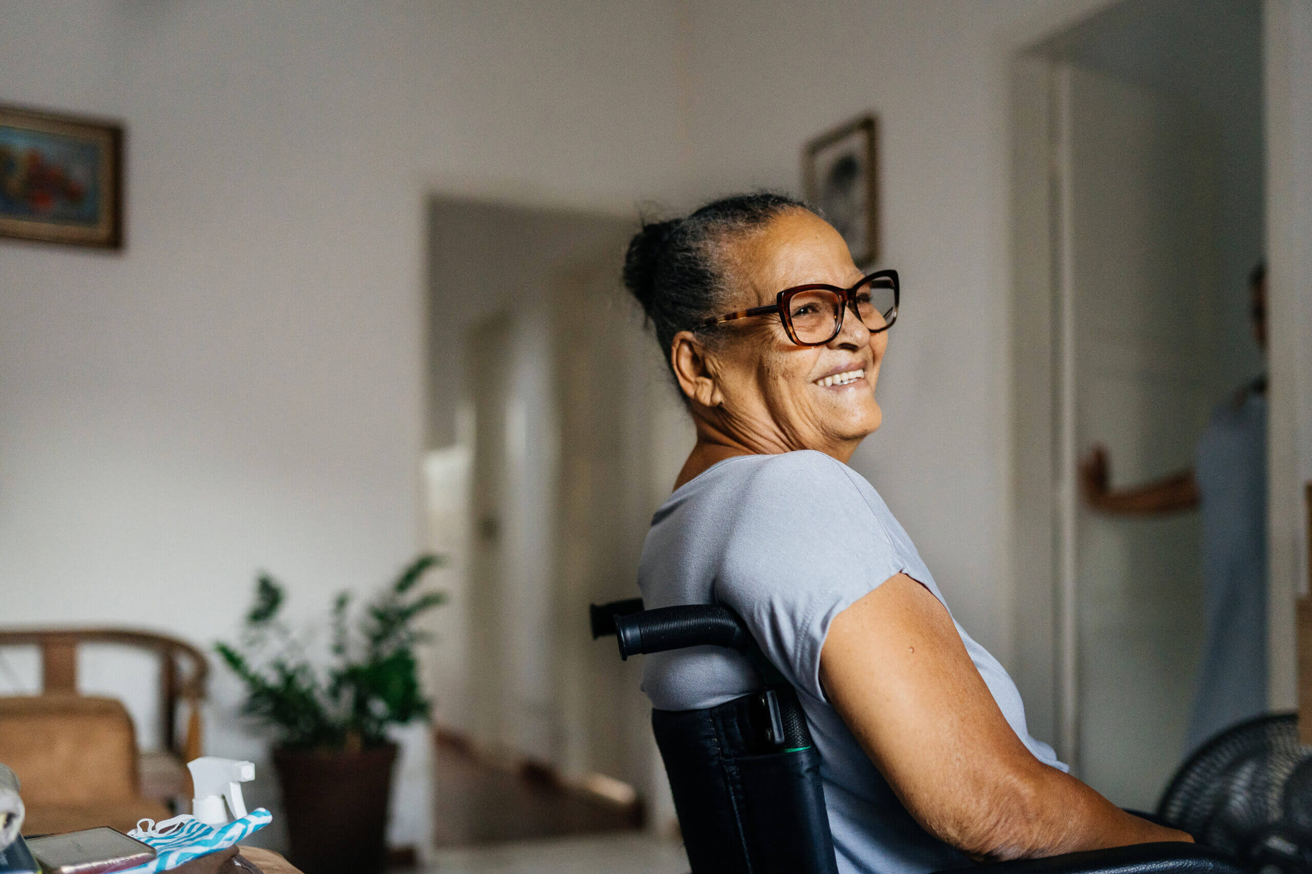 Wheelchair woman smiling in the room