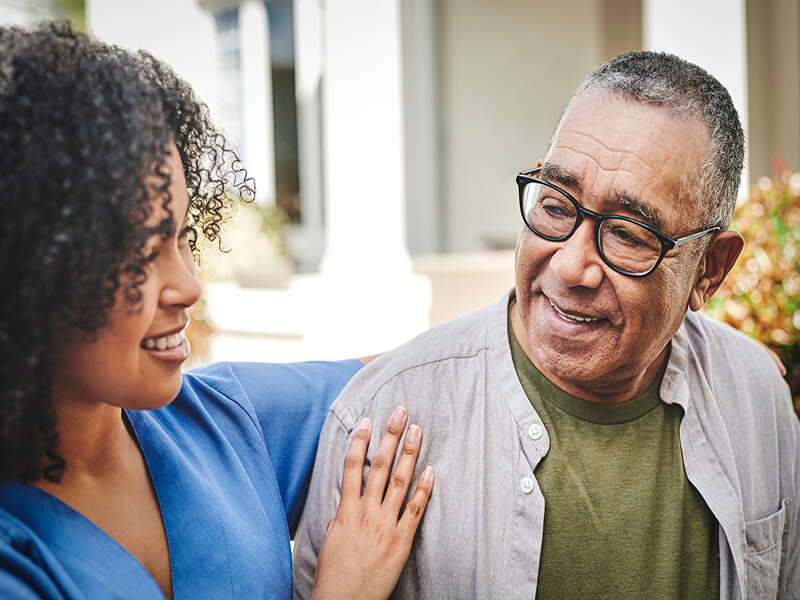 Shot of a senior man bonding with his nurse during a day outside