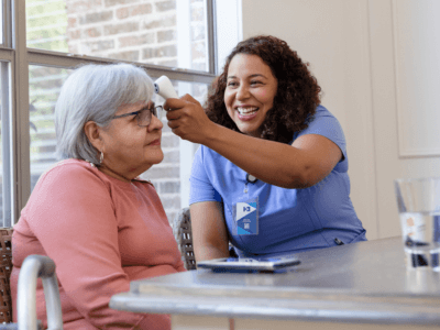 Home health aide providing services in the home.