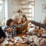 family around dinner table during the holidays